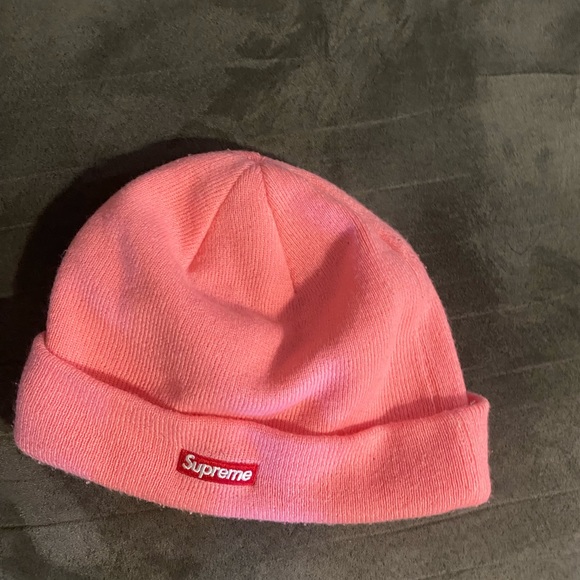 pink supreme beanie with blue and red logo